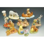 Nine boxed Royal Doulton 'Classic Pooh' figures.