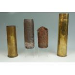 A 1942 M8 75 mm artillery shell case, a 1943 6-pounder shell case and two relic shells
