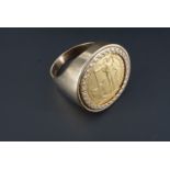 A 2006 gold Britannia coin ring, the coin clip-set into 9 ct gold, 18.6 g