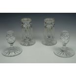 A pair of late 19th / early 20th century cut glass candle sticks together with another pair similar,