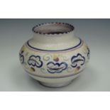 A Carter, Stabler, Adams Poole pottery vase, of oblate form, hand decorated with a band of