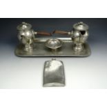 A four piece Lion Pewter coffee set together with a pewter hip flask
