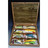 Cased fishing lures, as new, approximately thirty one