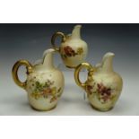 Three graduated Royal Worcester blush ivory jugs, with enamelled floral decoration, shape 1094, 13.5