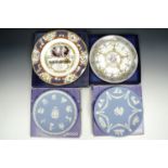 Two Wedgwood jasperware plates together with two other royal commemorative plates