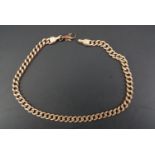 A 9 ct gold faceted curb link bracelet, 21 cm, 8.7 g