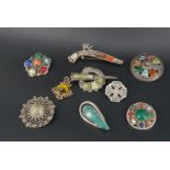 An Israeli white metal brooch set with malachite, and a small selection of Celtic and Scottish