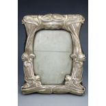 An Edwardian Art Nouveau silver photograph frame, William Neale, Chester, 1901, 18.5 cm x 15 cm