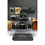 A Instamatic 100 camera together with a quantity of other vintage cameras