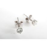 A pair of contemporary diamond and 9 ct white gold stud earrings, the diamonds of approx 2 mm