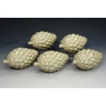 Five ornamental glazed ceramic pine cones, 16 cm long