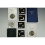 A boxed Festival of Britain 1951 five shilling coin, together with seven commemorative crowns etc