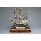 A limited edition silver model of the Mary Rose, on variegated marble and wooden base, 1982, base