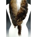 A vintage mink fur wrap together with a similar scarf