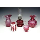 Victorian cranberry glass chamber oil lamp, with two cranberry glass jugs and a small basin, with