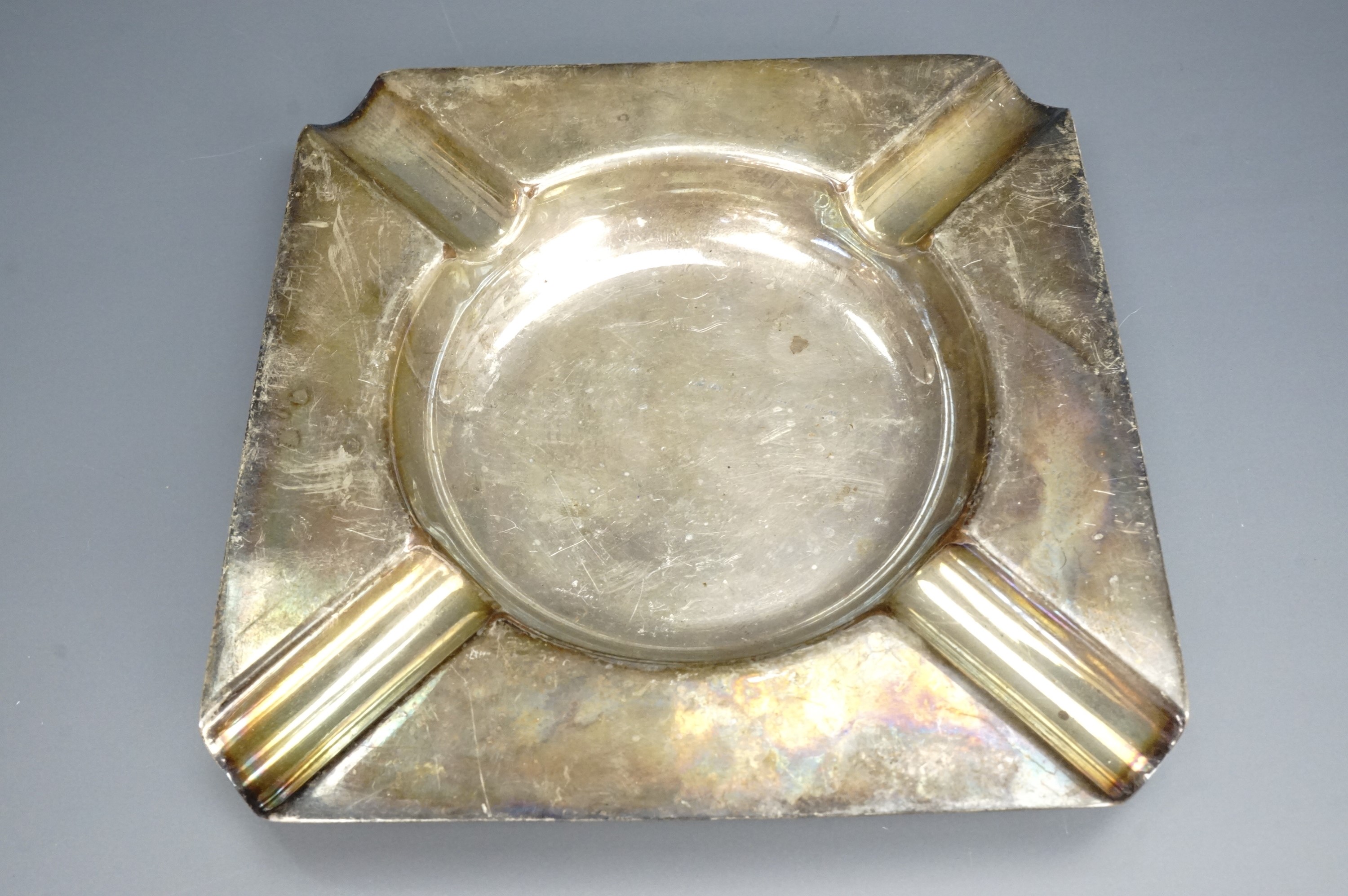 An electroplate ashtray stamped "metal from HMS Rodney", 10.5 cm