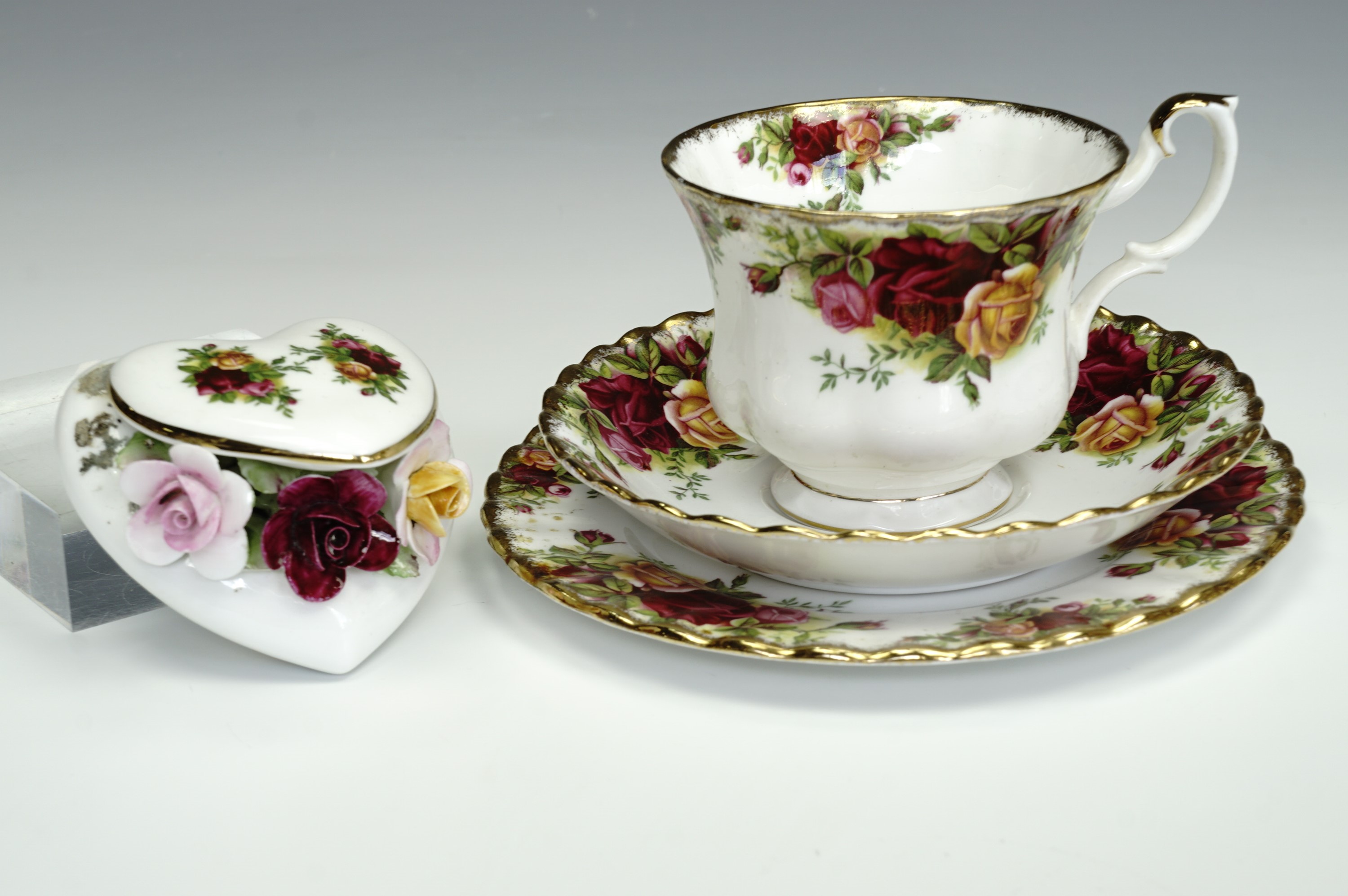 A Royal Albert 'Old Country Roses' cup, saucer and plate together with a matching heart and roses