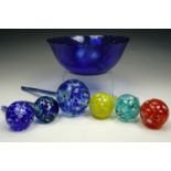 A Glcoloc French glass bowl together with six glass watering globes, longest 30 cm