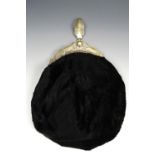 A William IV black velvet purse, its cantle foliate engraved and dated 1837, together with a