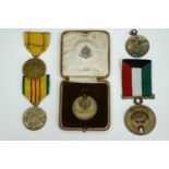 A 1930s Northumberland Fusiliers sports medal, a Liberation of Kuwait medal, US and other medals