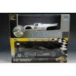 A Norev 1:18 scale die-cast model of a Peugeot 908 together with another