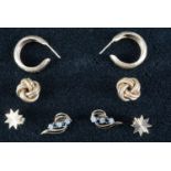 A pair of 9 ct gold knot earrings, together with 9 ct hoops and studs, and a pair of sapphire, white