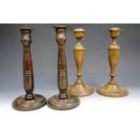Two pairs of turned oak candlesticks, tallest 29 cm