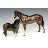 A Beswick Shetland pony, 1033, together with a Beswick hunter horse figure, tallest 21 cm