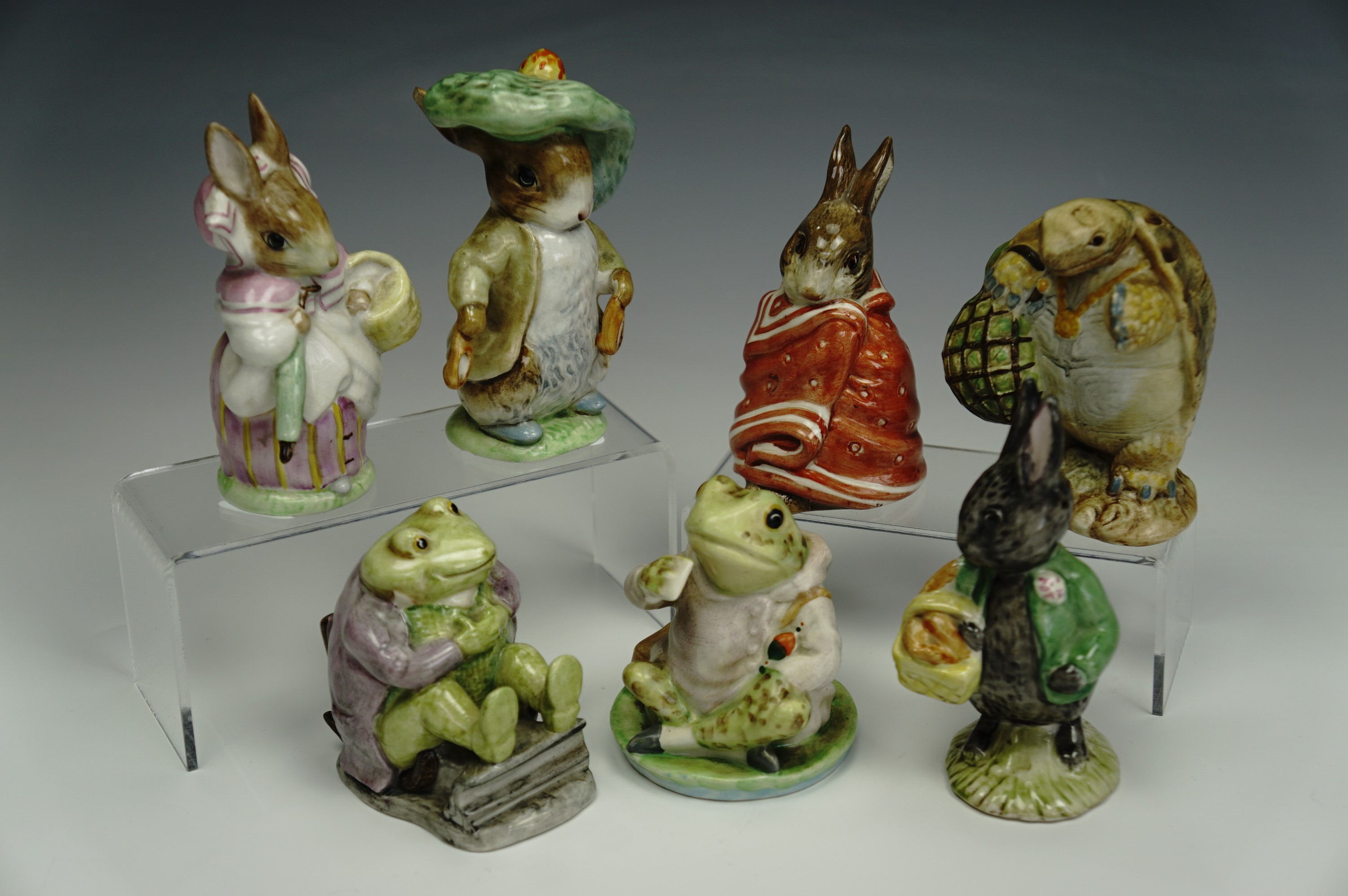 Seven Beswick Beatrix Potter figurines including frogs, tallest 11 cm