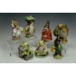 Seven Beswick Beatrix Potter figurines including frogs, tallest 11 cm