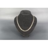 A 9 ct gold faceted curb link neck chain, 50 cm, 13.4 g