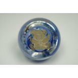 A Caithness 2000 "Birth of a New Millennium" glass paperweight