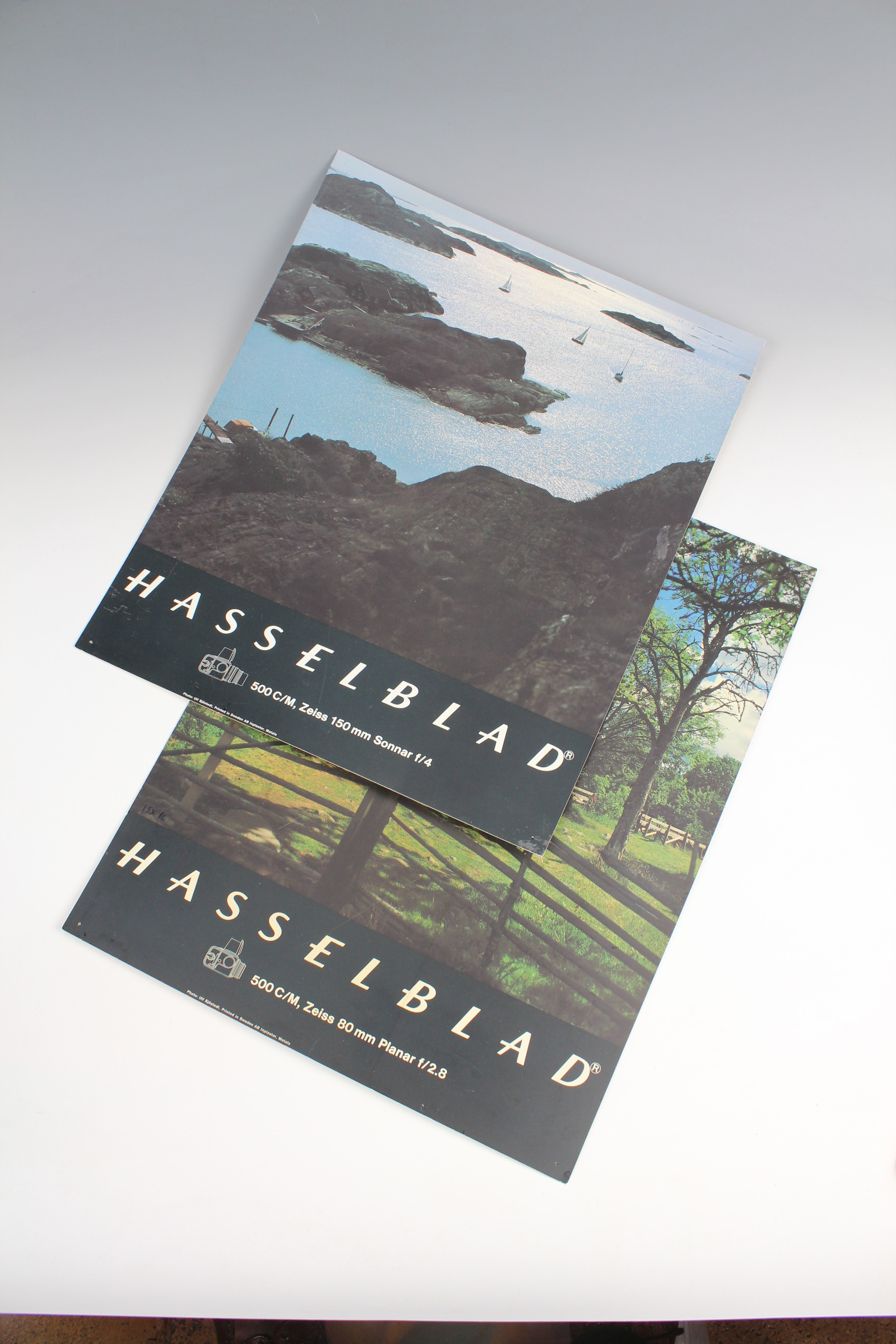 Vintage official Hasselblad promotional posters (printed on plastic), a calendar and desk pad
