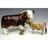A Beswick Jersey cow "Champion Newton Tinkle", together with a Beswick blue tit and a