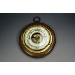 A small wall barometer, 10 cm