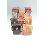 A quantity of vintage leather camera cases
