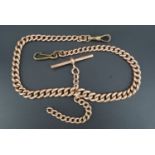 A late 19th / early 20th Century 9 ct rose gold double watch chain of graded curb links, (having
