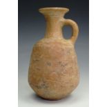 An ancient Roman redware / red slip earthenware flagon, having a tapering body, slender neck with