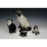 Three Kensington Winstanley cat figurines together with other similar, tallest 35 cm