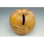 A Victorian terracotta novelty moneybox, modeled as an apple and retaining much of its original