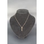 A contemporary 9 ct gold knot-and-bauble pendant necklace, the chain of fine box links, 42 cm, 2.4 g