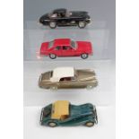 A group of die-cast classic luxury cars