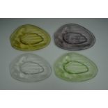 Four Art Nouveau Lalique style nut dishes, in four different colours of glass.