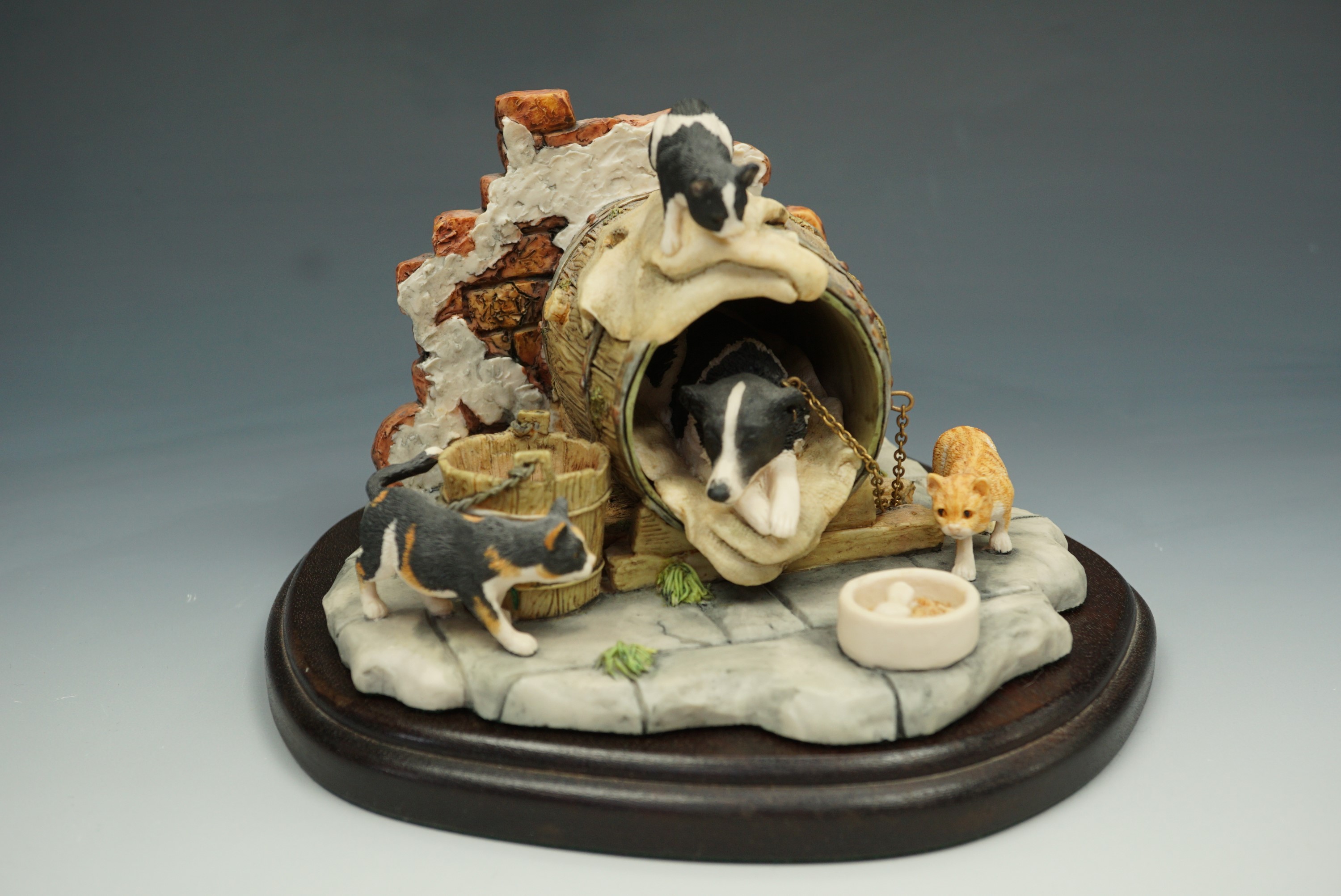 A Border Fine Arts figurine 'Let Sleeping Dogs Lie' boxed, 12 cm