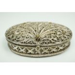 A small oval filigree box, 5 cm x 3.5 cm