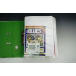 A folder of 1990s Carlisle United football programmes and match day tickets together with a folder
