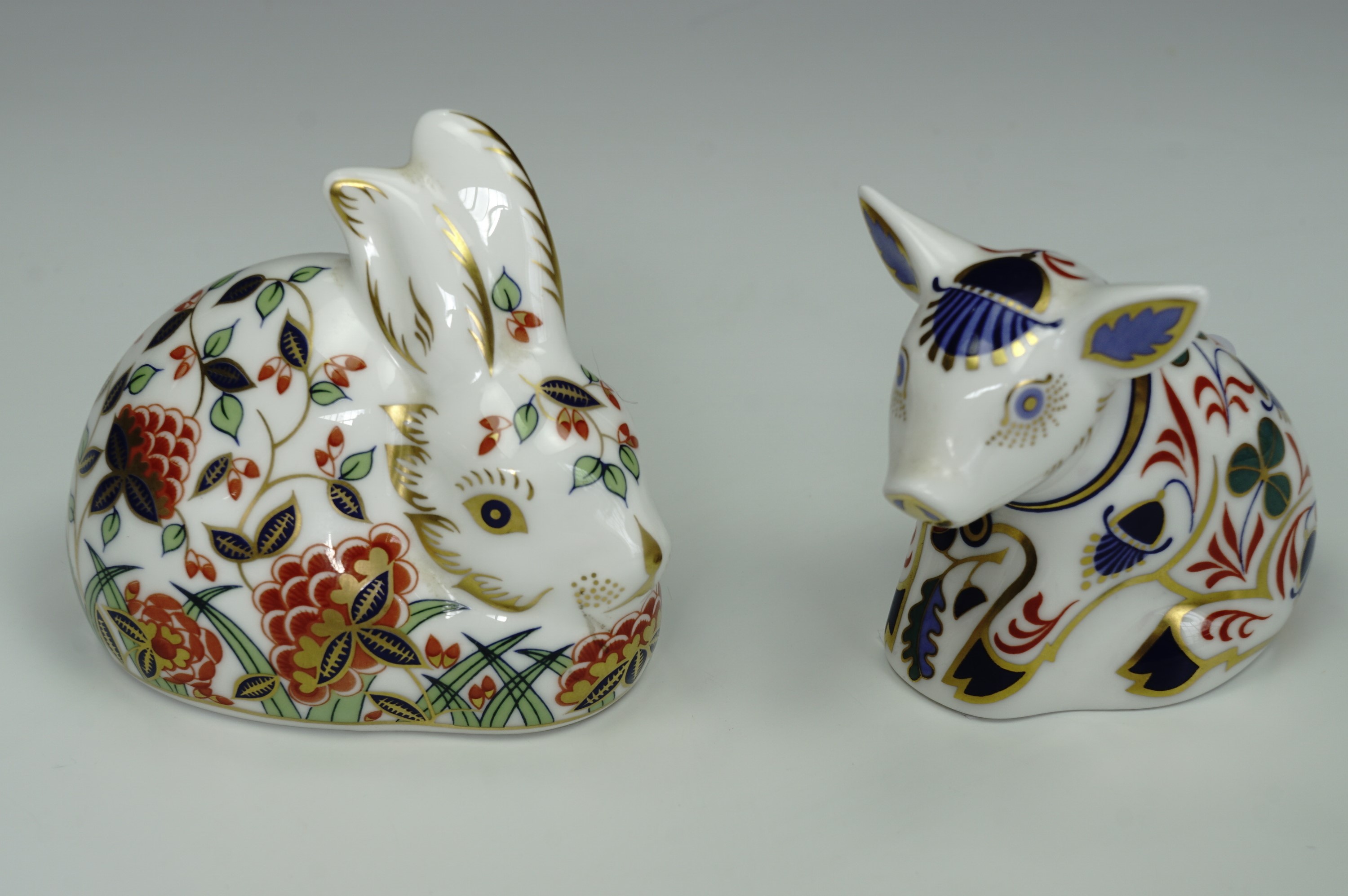 Two Royal Crown Derby paperweights; Meadow Rabbit and Pig, both with gilt seals, tallest 7 cm