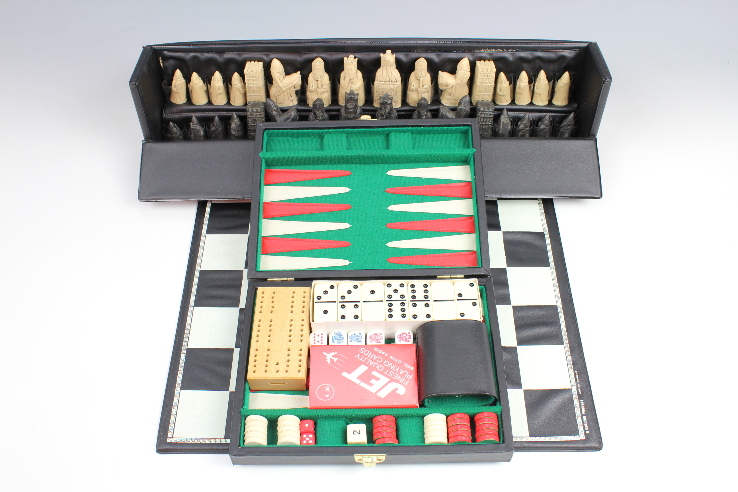 A Lewis chess set, Kings 63 mm, resin, circa 1970s, together with a travel backgammon set