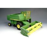 An ERTL die-cast toy John Deere 6600 combine harvester, 32 cm