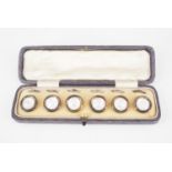A cased set of six vintage mother-of-pearl dress waistcoat buttons, second quarter 20th Century